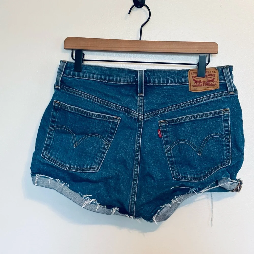Levi Jean shorts cutoffs with raw hem size 31 with button up fly
